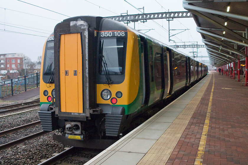 350108, LM 06.35 Northampton-Crewe (2U21), Rugby station 
 Having arrived at Rugby we realised that we had missed the Glasgow train so I took a leisurely picture of the rear of our train from Northampton. 350108 forms the 06.35 Northampton to Crewe. 
 Keywords: 350108 06.35 Northampton-Crewe 2U21 Rugby station