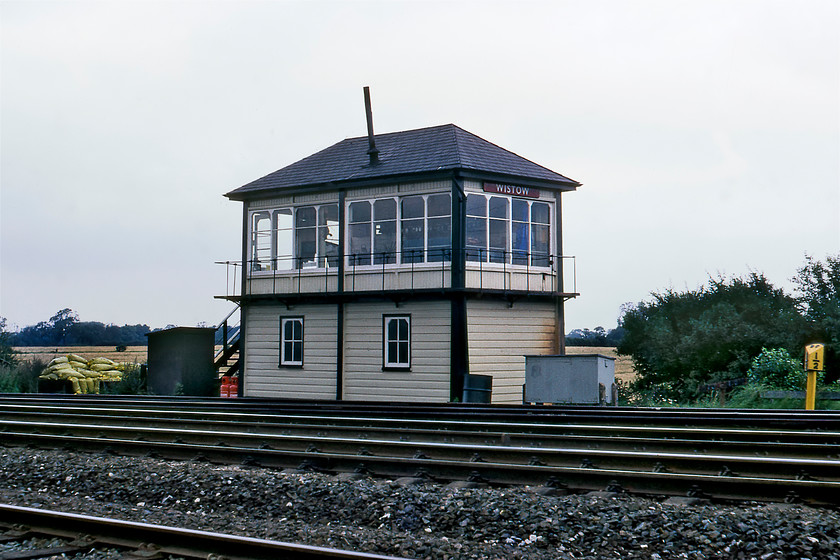 Wistow signal box (Mid, date not known) 
 According to the milepost located at ninety-one and a half miles from London St. Pancras Wistow, signal box is seen in a particularly remote location. In fact, it took Graham and me quite some time to reach the box navigating our way through a number of fields and assaulting an embankment! It is a Midland box but its date of opening is not known unless anybody can supply me with the information? A further indication of the remoteness of the box is the bags of coal stacked up next to the box that will have been delivered by a passing train that will have stopped in the adjacent loop. 
 Keywords: Wistow signal box Midland Railway