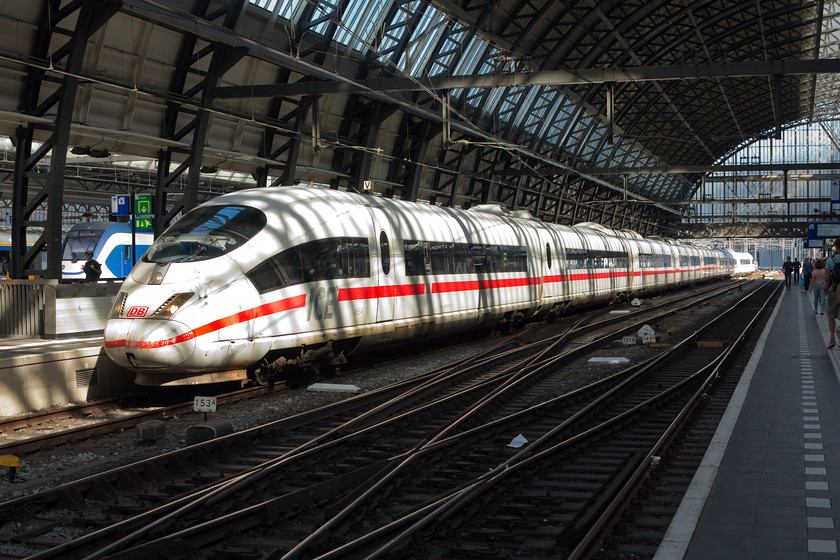 406054, 13.29 Frankfurt Hbf-Amsterdam Central (ICE 124), Amsterdam Central station 
 Deutsche Bahn own and operate these class 406 ICE 3 units but for the services to and from Amsterdam there is a pool of sets that are jointly operated by DB and NS. Brimming with technology (that actually works!) they offer comfortable, reliable and high speed links between many northern European cities. Having worked the 13.29 from Frankfurt Hbf, 406054 prepares to make its way as ECS to a spot just west of Central station for a layover before working back to Germany a couple of hours later. 
 Keywords: 406054 13.29 Frankfurt Hbf-Amsterdam Central ICE 124 Amsterdam Central station