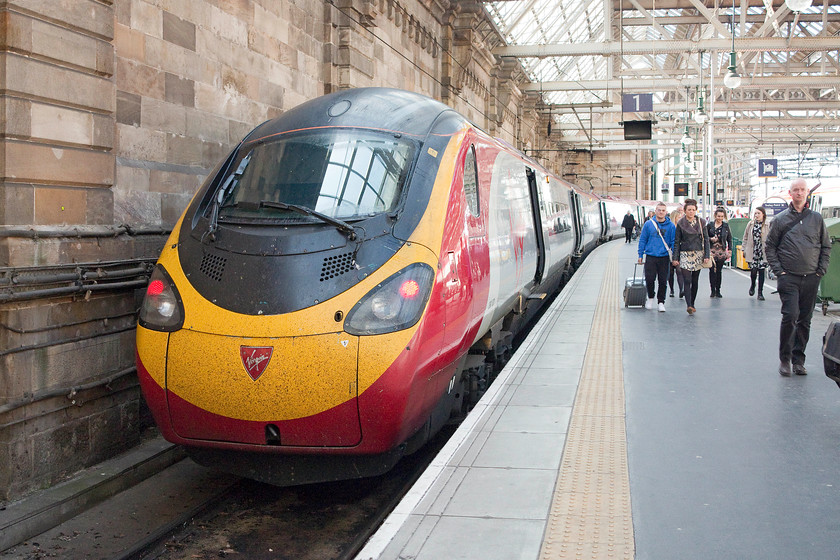 390001, VT 05.30 London Euston-Glasgow Central (1S37), Glasgow Central station 
 390001 'Virgin Pioneer' has stopped at the blocks of Glasgow Central station's platform one having arrived with the first down Anglo Scottish express of the day, the 05.30 from Euston. We travelled on this service from Rugby, a journey time of nearly four hours made in relative comfort courtesy of Mr. Branson. 
 Keywords: 390001 05.30 London Euston-Glasgow Central 1S37 Glasgow Central station