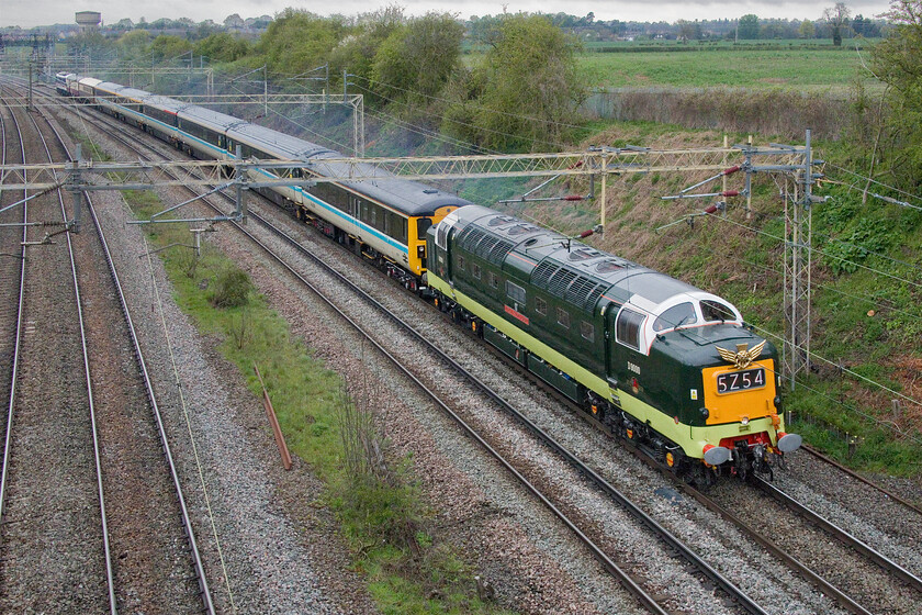 D9000 (55022), 07.10 Crewe HS-London King's Cross (5Z54, 10E), Victoria bridge 
 What a sight (and sound!) to behold! D9000 (55022) Royal Scots Grey passes Victoria bridge between Roade and Ashton leading a set of LSLs fine reproduction InterCity stock that includes their recently unveiled DBSO 9701. The Deltic was leading the 5Z54 07.10 Crewe HS to Kings Cross empty stock move with 90001 Royal Scot on the rear. The sight and sound of a Deltic never fails to disappoint especially when the driver was giving it some beans as he was here having just climbed the steady rising grade from Northampton and through Roade cutting. 
 Keywords: D9000 55022 07.10 Crewe HS-London King's Cross 5Z54 Victoria bridge Deltic Royal Scots Grey