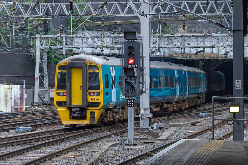 158840, AT 10.09 Birmingham International-Aberystwyth & Pwllheli (1J11 & 2J11), Birmingham New Street station 
 158840 leaves New Street station into the darkness of New Street North tunnel forming the ATW 10.09 from Birmingham International to Aberystwyth and Pwllheli. Out of sight in the tunnel is another Class 158 with the two units splitting at Mchynthleth with them running separately to their relative destinations. 
 Keywords: 158840 10.09 Birmingham International-Aberystwyth & Pwllheli 1J11 2J11 Birmingham New Street station ATW Arriva Trains Wales