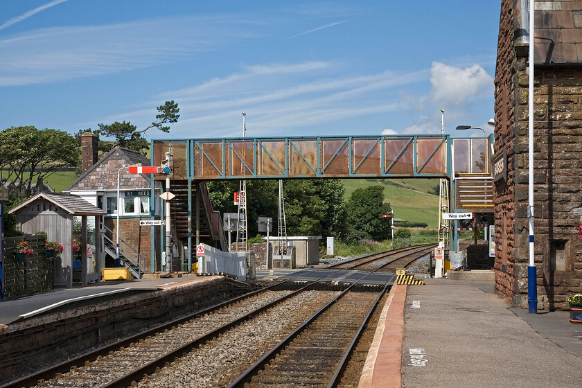 St. Bees signal box (Furness, 1891) & station 
 My third and final image of St. Bees signal box sees it taken from the up platform of the station. It really is a lively spot in a pleasant little village and just over a mile from the sea. When the inevitable modernisation of the Cumbrian Coast route takes place at least the signal box will remain as it is Grade II listed by Historic England. 
 Keywords: St. Bees signal box Furness station