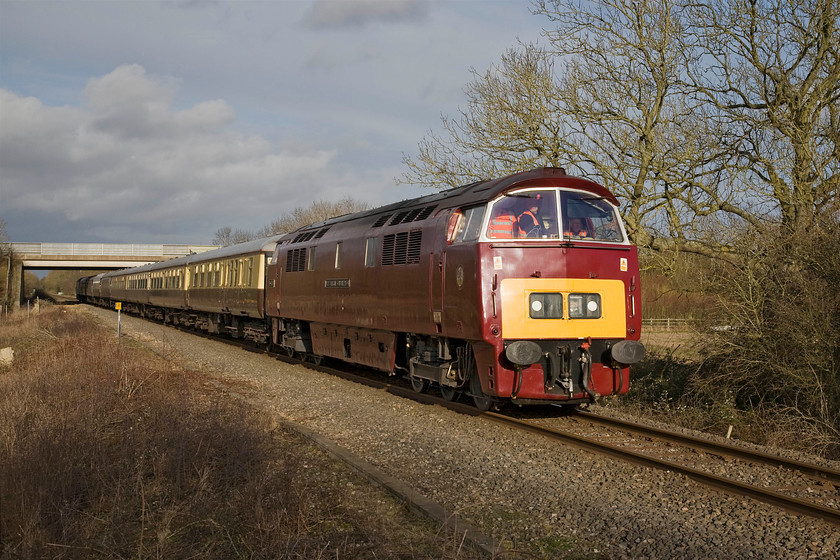 D1015, return leg of The Chiltern Champion 1, 12.40 London Marylebone-Oxford (1Z55), Wendlebury SP561182 
 It looks a little crowded in the cab of D1015 'Western Champion' as it gets The Chiltern Champion railtour away from Bicester as it heads for Oxford. Running as 1Z55 it left Marylebone at lunchtime following the GC GWR Joint route to Quainton Road to then reverse at Claydon Junction. This will be the last charter to traverse this railway backwater as it is to be closed in five days time and then will be comprehensively reconstructed as the first phase of the fabled east-west rail link. It is due to open again in the summer of 2016....we'll see! 
 Keywords: D1015 The Chiltern Champion 1 12.40 London Marylebone-Oxford 1Z55 Wendlebury SP561182 Western Champion