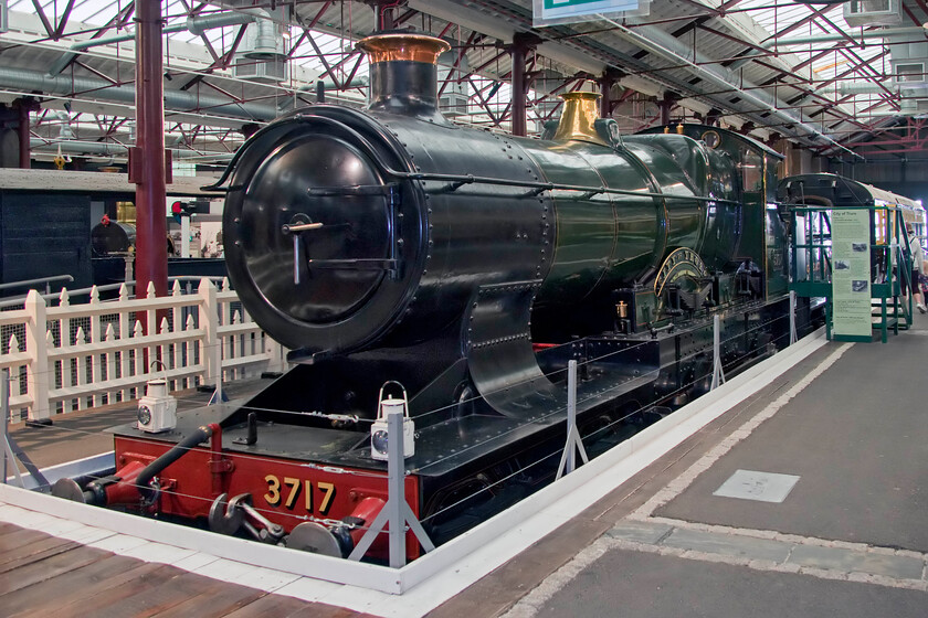 3717, on display, Steam museum, Swindon 
 As 3440 'City of Truro' is well known as being the first locomotive to 'officially' break the one hundred miles per hour record on a decent of Wellington bank on 09.04.1904. However, there remains much debate as to the validity of the claim and I suspect the truth will never actually be known for sure! Wearing its later number of 3717 it is seen in Swindon's Steam museum now in what will probably be a permanent state of display rather than in steam due to major mechanical issues relating to its boiler. Maybe, at some time in the future, its fortunes will change and it will undergo a refurbishment to get it back in steam again. 
 Keywords: 3717 on display Steam museum Swindon