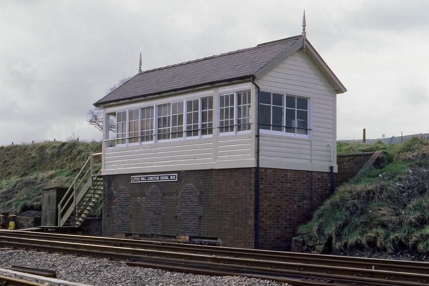 Little Mill Junction signal box (GWR, 1883) 
 Little Mill Junction signal box is a lovely GWR structure dating from 1883. In this view, it looks largely in its as-built state with timber window frames, a cast plate, a slate roof and a pair of finials. The only visual change is the bricking up of the locking room windows that was probably undertaken during wartime. It sits at the point where the line to Usk, Monmouth and ultimately Ross-on-Wye diverged from the Marches route. There was also a station at this point until closure on 30.05.55. I revisited this spot during a trip in 2016, see...... https://www.ontheupfast.com/p/21936chg/25752990204/little-mill-junction-signal-box but the location is hardly recognisable! 
 Keywords: Little Mill Junction signal box (GWR, 1883)