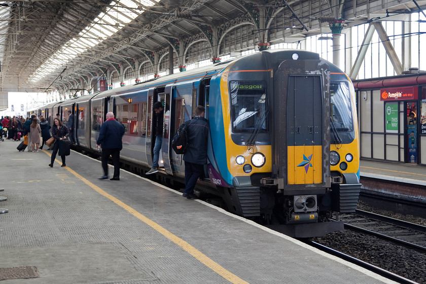 350401, TP 13.00 Manchester Piccadilly-Glasgow Central (1S61, RT), Preston station 
 Trans Pennine Express operated 350401 pauses at Preston whilst working the 13.00 Manchester to Glasgow. As well as passengers changing here there is also a crew change taking place. I presume that a Scottish driver is working this service forward. These class 350/4s have an 'Inter city' style layout making them more suited to the longer journeys that they undertake compared to their 350 cousins operated by London Northwestern. They are planned to come off this route in spring 2019 being replaced by TPE's new class 397s. 
 Keywords: 350401 1S61 Preston station