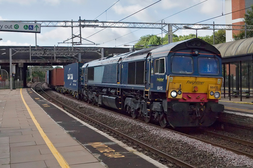 66145, 04.31 Southampton FLT-Lawley Street FLT (4M62), Wolverton station 
 The 4M62 04.31 Southampton to Lawley Street Freightliner is diverted on to the WCML instead of its usual route via Oxford and Banbury. It is seen passing through Wolverton station seconds after the train that I had travelled from Northampton on had disappeared from view on the up slow. 
 Keywords: 66145, 04.31 Southampton FLT-Lawley Street FLT 4M62 Wolverton station