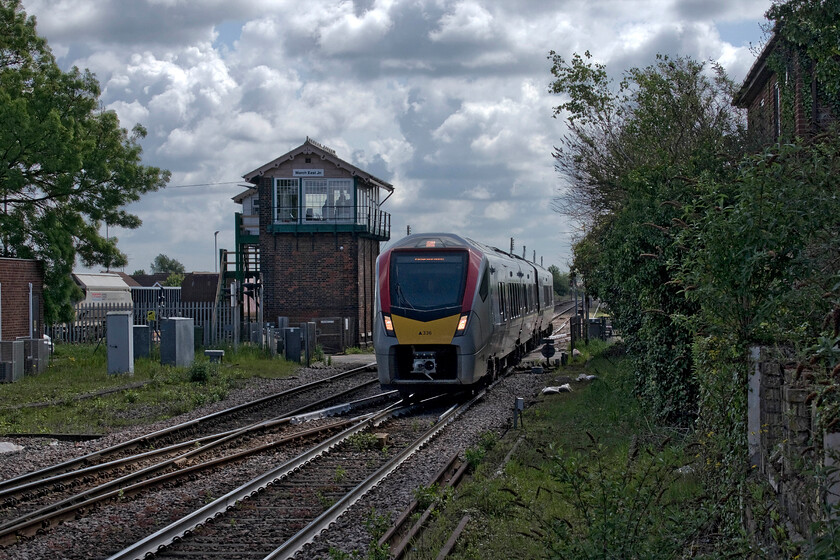 755336, GA 10.01 Ipswich-Peterborough (2E74, RT), March station 
 Greater Anglia's 755336 passes over the B1101 level crossing whilst the signalman in March East Junction's imposing signal box looks on waiting to open the gates again to road users. Whilst he does not operate any semaphores on the main running lines there is mechanical signalling controlling the sidings to the rear of the box. The GA FLIRT unit is the new face of operations in the east of England with this one working the 10.01 Ipswich to Peterborough service that operates a shuttle diagram throughout the day. 
 Keywords: 755336 10.01 Ipswich-Peterborough 2E74 March station GA Greater Anglia Stadler rail FLIRT