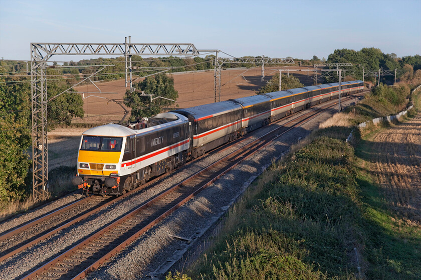 90002 & 82139, 16.21 Manchester Piccadilly-London Euston (1Z96, 4L), Milton crossing 
 Making a fine sight in the evening sun at Milton Crossing between the Northamptonshire villages of Roade and Blisworth 90002 'Wolf of Badenoch' powers the rear of the 1Z96 16.21 Manchester Piccadilly to Euston service. This was the fifth time that I had recorded a loco. hauled service on this day, not something that I have done for many years! 
 Keywords: 90002 82139 16.21 Manchester Piccadilly-London Euston 1Z96 Milton crossing InterCity Swallow Wolf of Badenoch