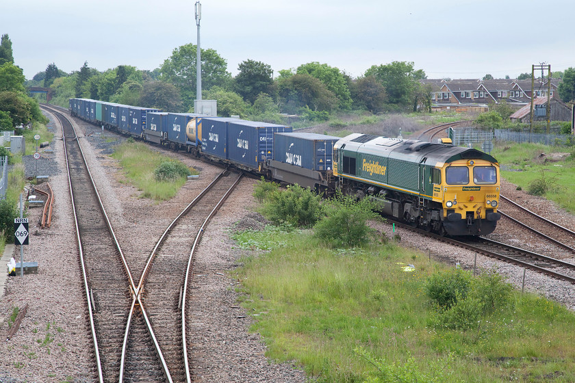 66588, 10.27 Leeds FLT-Tees Dock (4N01), Eaglescliffe station 
 To the southern end of Eaglescliffe station there is a junction. Off to the the right is the line to Darlington via the infamous Teeside Airport station. In this image, 66588 is leading the 4N01 10.27 Leeds FLT to Tees Dock Freightliner off the line that diverges from the ECML at Northallerton. 
 Keywords: 66588 10.27 Leeds FLT-Tees Dock 4N01 Eaglescliffe station