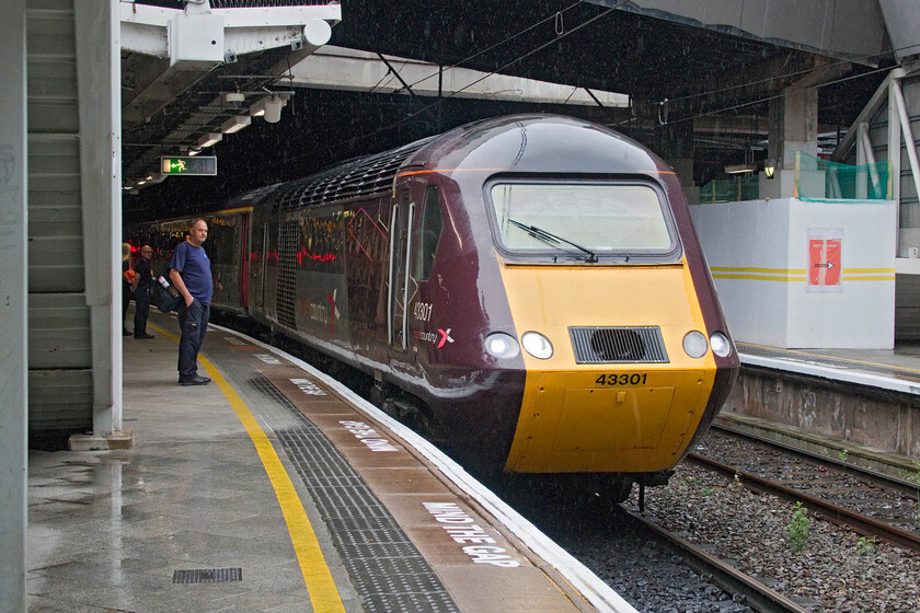 43301, XC 06.12 Leeds-Plymouth (1V44, 4L), Birmingham New Street station 
 This is what Andy and I have come to Birmingham for having to make an early start from Northampton! 43301 comes to a halt at platform ten with the 06.12 Leeds to Plymouth service. With CrossCountry's refurbishment, they still look fresh and purposeful and a train that the travelling public instantly recognises. However, close inspection does reveal cracks and signs of water ingress in places! Andy and travelled on the 1V44 service as far as Bristol enjoying the luxury of a Mk. III coach even if the automatic sliding door behind us would not close making it a little louder than normal. There was much interest on the platform including from the ROG driver seen to the left of the train. He told us that there were talks ongoing regarding the CrossCountry sets possibly going to either Mexico or South Africa after they are returned to Portobrook at the end of the summer. If they go to the latter, the HSTs will need to be re-gauged which would be interesting! 
 Keywords: 43301 06.12 Leeds-Plymouth 1V44 Birmingham New Street station CrossCountry HST