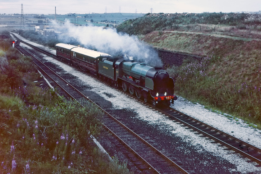 850, Gresley coaches, Skipton-Manchester Liverpool Road (for Great Railway Exposition), Goose House Bridge SD690236 
 After being held somewhere in the Blackburn area 850 'Lord Nelson' is captured again hauling its two Gresley coaches from Skipton to Manchester Liverpool Road as part of the Rocket 150 celebrations. It is seen in the dying evening light approaching Goose House bridge, a short distance north of Darwen. The line here was singled a short time after this photograph was taken, having no passenger services at this time probably as a precursor to closure by BR. However, this did not take place and in recent years a passenger service has been re-introduced along with some new station openings and the line has been doubled in its entirety. 
 Keywords: 850 Gresley coaches Skipton-Manchester Liverpool Road Great Railway Exposition Goose House Bridge SD690236 Lord Nelson Rocket 150