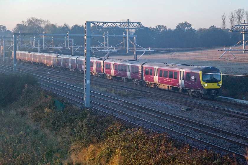 360114 & 360103, EM 06.47 London St. Pancras-Corby (1Y05, 2L), Harrowden Junction 
 In the cold early morning light at Harrowden Junction just north of Wellingborough the 06.47 St. Pancras to Corby service passes worked by 360114 and 360103. The camera struggled a little with the lighting, particularly with the colour temperature - something that all Canon cameras always seem to have issues with in my experience. However, as usual, Photoshop has come to the rescue and sorted things out. Incidentally, to achieve the shutter speed necessary the ISO was set to 2500 thus introducing a little digital noise. 
 Keywords: 360114 360103 06.47 London St. Pancras-Corby 1Y05 Harrowden Junction EMR Desiro