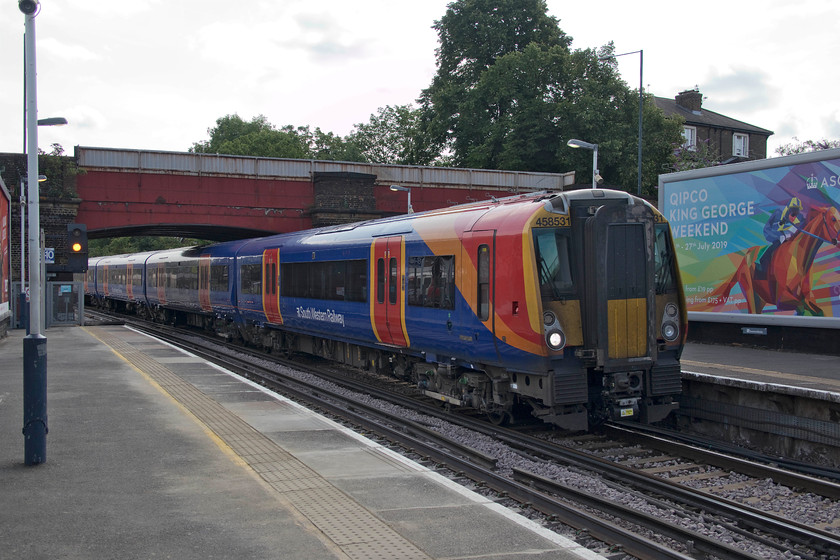 458531,SW 09.50 London Waterloo-Reading (2C23, RT), Richmond station 
 South Western Railway's 09.50 Waterloo to Reading arrives at Richmond station formed by 458531. Notice the large advertising hoarding proclaiming the Royal Ascot weekend in two weeks time. 
 Keywords: 458531 09.50 London Waterloo-Reading 2C23 Richmond station