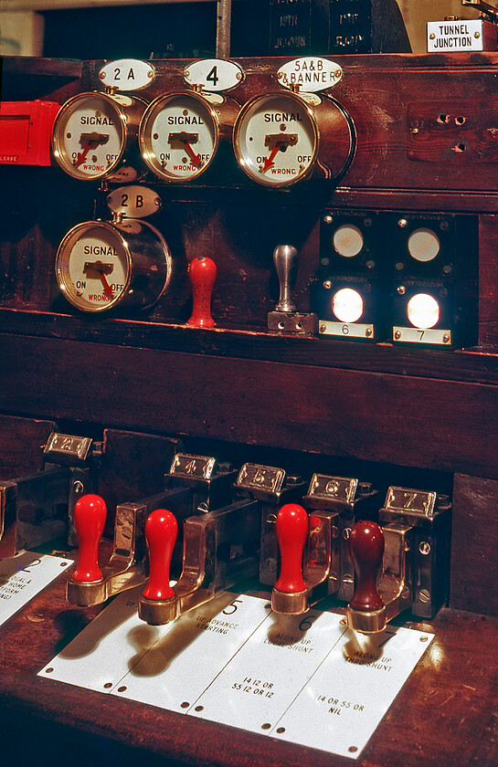 Signal slides & indicators, Salisbury East signal box 
 Details of the slides that operate the signalling and point work from the inside of Salisbury East signal box. The different colours of the handles of the slides were very similar to the way that conventional levers were painted. Notice the indicators to the top of the photograph that, despite the box closing in a week's time, were still well polished! 
 Keywords: Signal slides & indicators, Salisbury East signal box