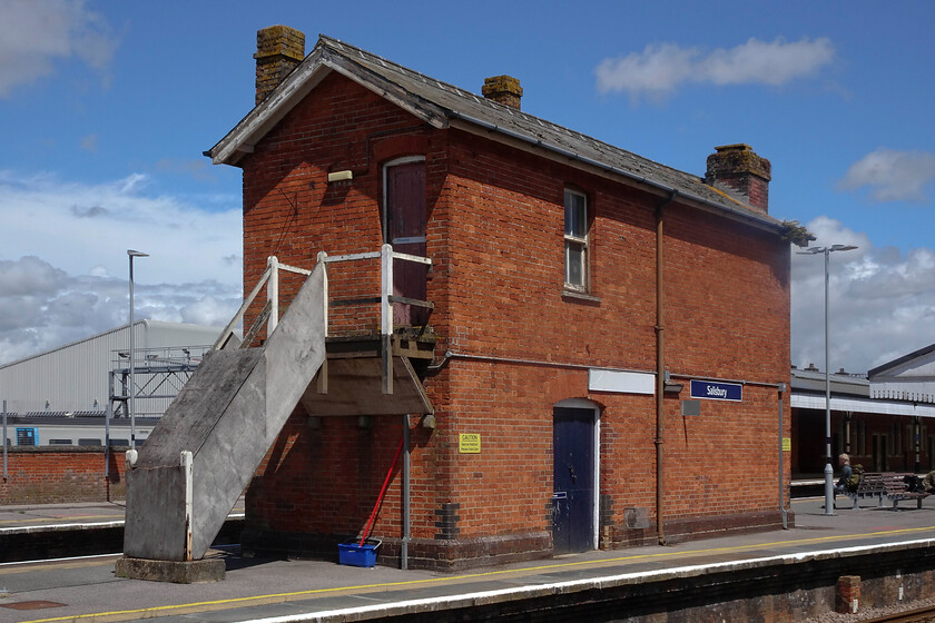 Building (former signal box?), Salisbury station 
 I have seen discussion that this stricture is a former signal box on Salisbury station and it certainly looks like one. However, I am not at all convinced as it has no windows or evidence that there were windows t the upper level. I have also to find any information about the structure in the Signalling Records Society book or in the internet; can anybody advise? All I do know is that the swifts were making the best use of it now with many nests under the eves. 
 Keywords: Building former signal box Salisbury station