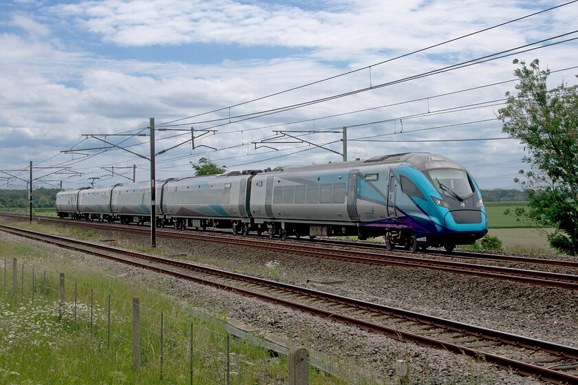 397012, TP 12.02 Preston-Glasgow Central (1S51, 3L), Mossband M6 bridge NY347654 
 397012 passes Mossband a short distance south of Gretna working the 12.02 Preston to Carlisle TransPennine Express service. The Nova 2 units have been in service for a year and a half now ousting the Class 350/4 Desiros that have moved south to augment London NorthWestern's operations. 
 Keywords: 397012 12.02 Preston-Glasgow Central 1S51 Mossband M6 bridge NY347654 Nova 2 TPE TransPennine Express