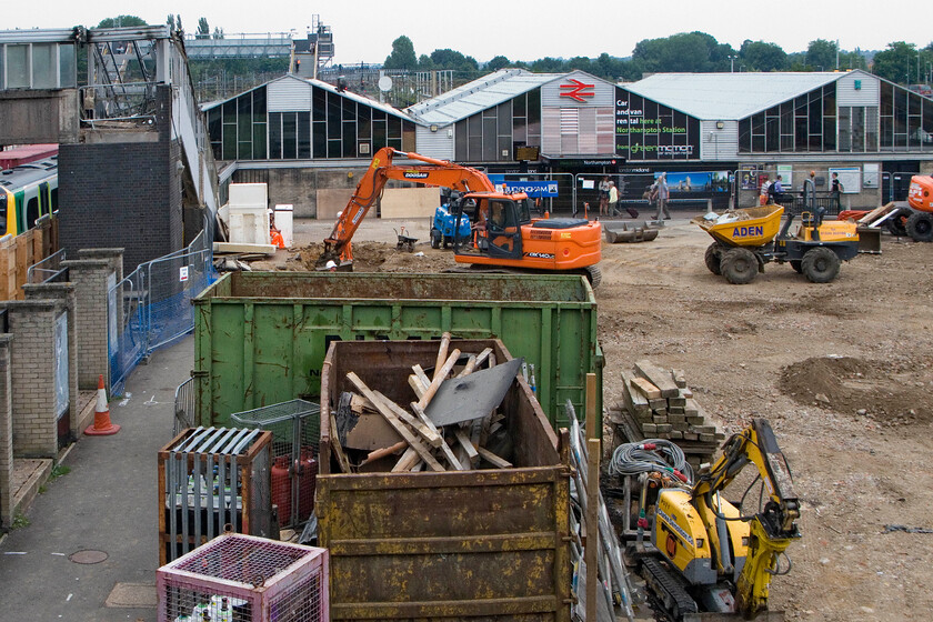 Frontage & re-development, Northampton station 
 Whilst the infamous 'three cowsheds' are still very much in use as a functioning station the developments in the former front car park are very much underway. According to the plans that I have seen the foreground will be where the new station building will be located with everything else seen in this scene demolished. I hope that the fine people of Northampton appreciate their shiny new station whenever it opens! 
 Keywords: Frontage re-development Northampton station