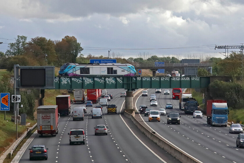 68019, 07.57 Eastleigh Arlington-Crewe Coal Sidings (6Z63, 15E), Old Towcester Road M1 bridge 
 68019 'Brutus' crosses the M1 near Northampton leading a short rake of newly built nuclear flask flats that are, unfortunately, out of sight behind the bridge parapet as the 6Z63 07.57 Eastleigh Arlington to Crewe Coal Yard. The DRS-owned and maintained Class 68 wears its Trans Pennine Express livery for which it will do no more work now that the state-owned company has announced it is dispensing with its five-year-old locomotive-hauled sets that are currently being eyed up by Chiltern. 
 Keywords: Brutus 68019 07.57 Eastleigh Arlington-Crewe Coal Sidings 6Z63 Old Towcester Road M1 bridge DRS TPE Trans Pennine Express