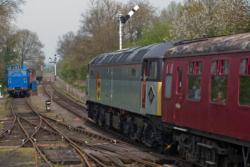 47395, 12.30 Pitsford return & 31289, Pitsford & Brampton station 
 47395 leaves Pitsford and Brampton station with the 12.30 return service. To the left, in an unusual version of BR blue, is 31289 undergoing a light restoration. 
 Keywords: 47395 12.30 Pitsford return 31289, Pitsford Brampton station