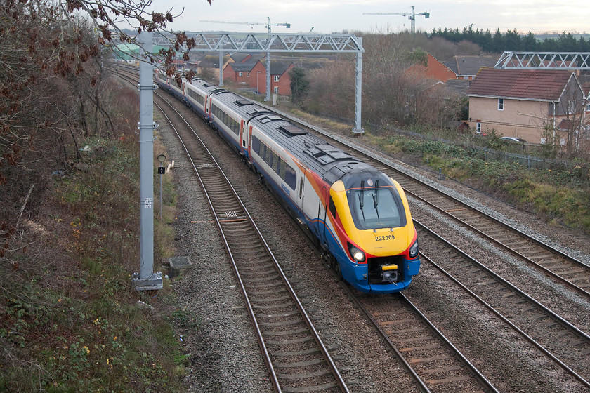 222009, EM 10.47 London St. Pancras-Corby (1M16, 2E), Headlands bridge 
 222009 forming the 10.47 St. Pancras to Corby takes the down slow line as it eases for its stop at Kettering about half a mile behind me here at Headlands bridge. Notice the electrification masts already beginning to hinder the view from this well know spot that it now only accessible if you take a ladder with you. 
 Keywords: 222009 10.47 London St. Pancras-Corby 1M16 Headlands bridge