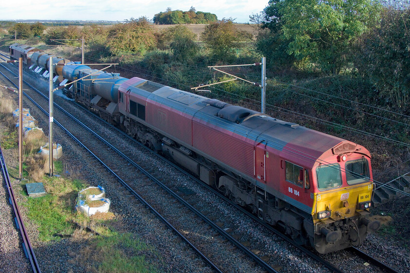 66104 & 66041, 23.17 Toton TMD-West Hampstead Thameslink (3J92, 6E), Park Road bridge TL020390 
 Unfortunately routed on to the up slow line meaning that it is in the shade the 3J92 23.17 Toton to West Hampstead railhead treatment train passes Park Road bridge near Millbrook. The train is led by DB Cargo's 66104 with 66041 at the rear. Whilst dirty both locomotives appear relatively clean compared to some RHTT locomotives that have been observed. Quite extraordinarily, this train is four hundred and sixteen miles into its four hundred and fifty-one-mile journey that involved two return trips treating all four tracks and going off-route via Corby and Melton Mowbray at some time in the middle of the night! 
 Keywords: 66104 66041 23.17 Toton TMD-West Hampstead Thameslink 3J92 Park Road bridge TL020390 RHTT Squirter