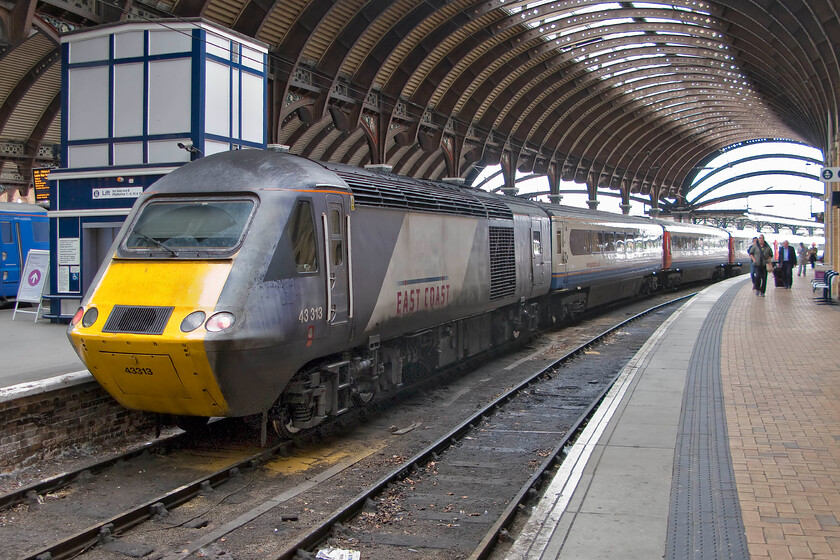 43313, GR 16.01 York-London King's Cross (1Y38), York station 
 With its former operator's livery, National Express East Coast, looking decidedly tatty 43313 stands at York station at the rear of the 1Y38 16.01 service to King's Cross. The stock of the HST service is composed of a hired-in East Midlands Trains set that does not exactly match the power car paint scheme! 
 Keywords: 43313 16.01 York-London King's Cross 1Y38 York station East Coast HST