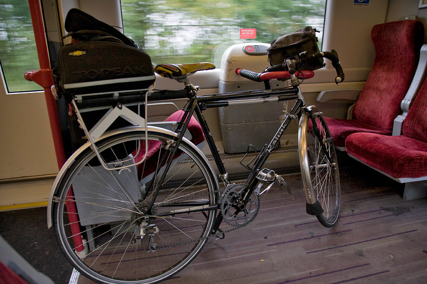 My bike on board 170109 
 With the 09.52 Birmingham New Street to Leicester service very lightly loaded I had no problems finding a seat and also keeping my trusty bike close by rather than putting it in the designated cycle storage space. I like the flexibility afforded by taking my bike on a train as part of an integrated journey but operators are making it increasingly difficult by providing less space for cycles and by putting in place all sorts of restrictions of carriage. The guard's area on a first-generation DMU or a standard coach of the past is much lamented but they simply don't seem to have any place in a modern railway. 
 Keywords: My bike on board 170109 Raleigh Royal