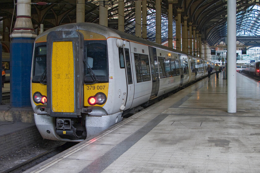 379007, LE 10.04 Cambridge-London Liverpool Street (2H21), London Liverpool Street station 
 A photograph to make a point! Being accompanied by a security operative who does not know the rules I deliberately made a point of stopping, setting up my camera and taking this view of 379007 at Liverpool Street's platform seven having arrived with the 10.04 from Cambridge. He tried to tell me that I was not allowed to take pictures of trains as it was a 'security risk'. Having been permitted access to the platform, albeit extremely reluctantly, I was present with permission. I reminded the operative of the rules on the taking of photographs that he chose to ignore. It really is a poor show that staff still are not made aware of the rules on the taking of photographs of trains. 
 Keywords: 379007 10.04 Cambridge-London Liverpool Street 2H21 London Liverpool Street station Electrostar