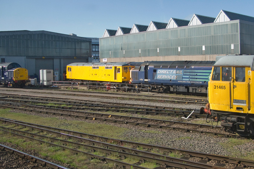 37716, 37682 & 31465, stabled, RVEL Derby 
 Basking in the spring sunshine outside Loram's Railway Vehicle Engineering Limited facility at Derby a number of almost vintage locomotives are seen. To the far left is 37716 then one of Network Rail's class 73s that have recently been converted from an electro-diesel to a full diesel. Next in the line up is 37682 followed by 31465. Without knowing the identity of the class 73 (can anybody advise?), by far the oldest locomotive in this scene is 31465 having been introduced in the summer of 1960 making it an incredible forty-five years old! 
 Keywords: 37716 37682 31465 RVEL Derby Railway Vehicle Engineering Limited RVEL Loram