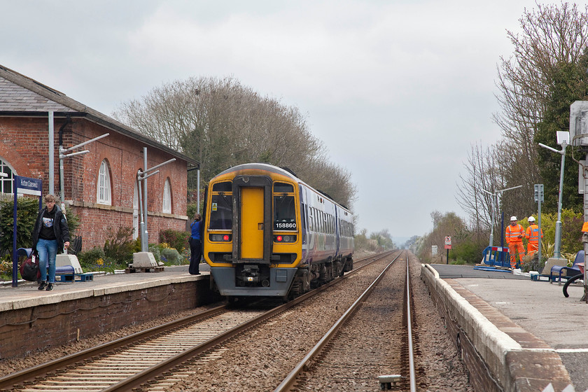 158860, NT 12.24 Sheffield-Bridlington (1W45, 1E), Hutton Cranswick station 
 158860 is about to leave Hutton Cranswick station with the 12.24 Sheffield to Bridlington 1W45 service. The building to the left is described as being the 'old station works' is now converted to flats for rental. Notice the contractors undertaking work to upgrade the station lighting to LED units 
 Keywords: 158860 12.24 Sheffield-Bridlington 1W45 Hutton Cranswick station