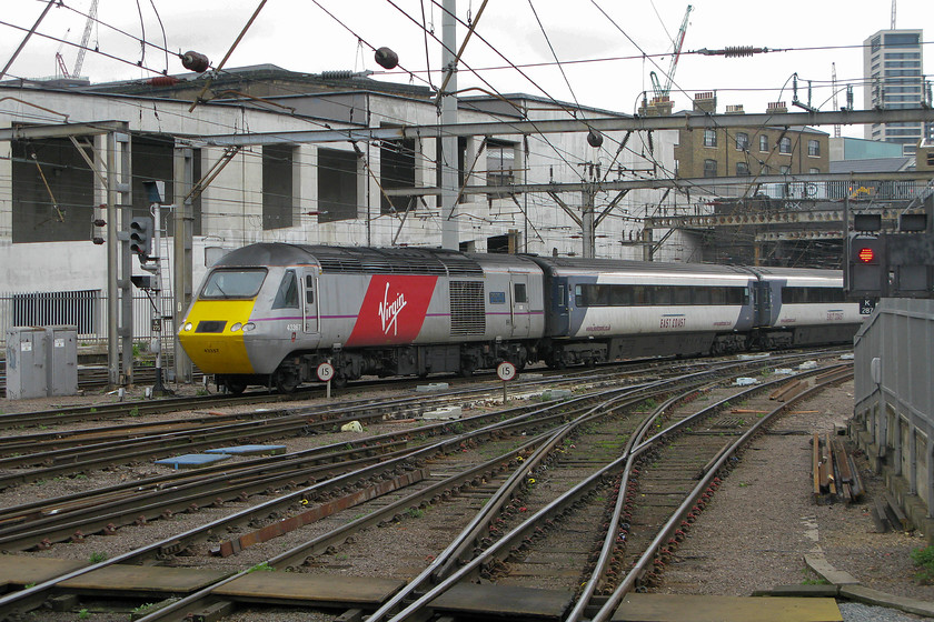 43367, GR 08.30 Edinburgh-London King`s Cross (1E07), London King`s Cross station 
 Mixed information as to which TOC is running the 08.30 Edinburgh to King's Cross HST service as it arrives at its destination! Virgin branded power car 43367 'Deltic 50 1955-2005 V' is leading the train whilst the stock is still wearing its state-owned and run East Coast branding. I do wonder about the effort and cost of re-branding everything from the stationary to the locomotives when a TOC changes, such is the nature of our privatised railway. 
 Keywords: 43367 08.30 Edinburgh-London King`s Cross 1E07 London King`s Cross station