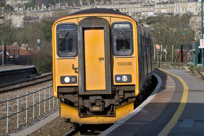 150246, GW 15.28 Warminster-Great Malvern (2E25), Bath Spa station 
 The sharp curve of Bath Spa station is shown to full effect in this zoom photograph of 150246 as it arrives with the 2E25 Warminster to Great Malvern service. Back in my youthful spotting days on Bath station in the late 1970s many trains composed of Mk.1 stock (and their variants) such as the Class 205s had doors positioned the length of the train meaning that passengers had to take great care when alighting from doors away from the carriage ends. 
 Keywords: 150246 15.28 Warminster-Great Malvern 2E25 Bath Spa station First Great Western