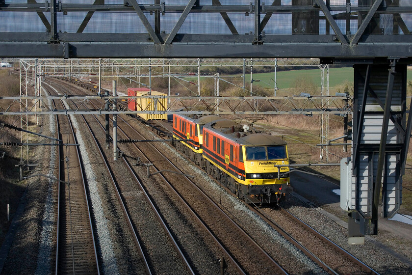 90011 & 90009, 10.20 Trafford Park-Felixstowe North (4L67, 8L), Gordon's Lodge 
 Matching liveried 90011 and 90009 pass Gordon's Lodge, located approximately seven miles north of Milton Keynes. The pair of Freightliner 90s are leading the daily 4L67 10.20 Trafford Park to Felixstowe North service. 
 Keywords: 90011 90009 10.20 Trafford Park-Felixstowe North 4L67 Gordon's Lodge Freightliner