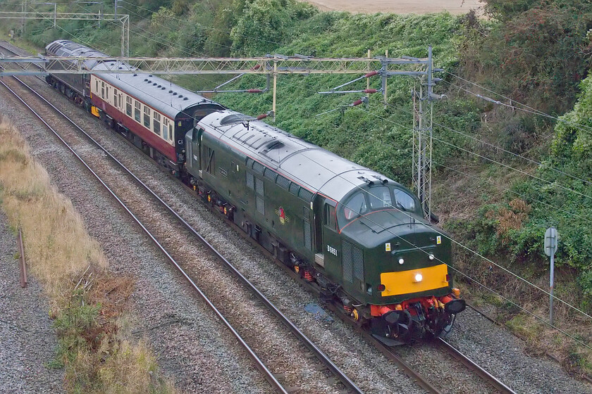 D6851 (37667) & 57311, 06.45 Crewe HS-Southall LSL (5Z94, 24E), Victoria bridge 
 An interesting and rarely seen (by me at least) pair of LSL's finest seen out on the mainline. Formally 37667 and now running as D6851 'Flosie' is seen leading a Mk.1 coach with 57311 at the rear going along for the ride. Running as 5Z94 the 06.46 Crewe HS to Southall LSL is seen passing Victoria bridge just south of Roade on a very dull and grey early September day. The unusual name afforded to the Class 37 is after LSL's owner, whose mother has been known as Flossie throughout her life. 
 Keywords: D6851 37667 57311, 06.45 Crewe HS-Southall LSL 5Z94 Victoria bridge LS Locomotive Services LTD Flopsie