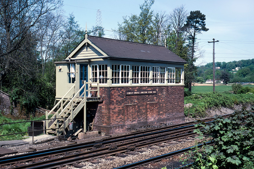 Cowley Bridge Junction Signal Box (GWR, 1894) 
 The superb Cowley Bridge Junction signal box was opened by the GWR in 1894 at the formerly important junction with its great rival the L&SWR. They both then shared track for the relatively short distance to Exeter St. David's. In this photograph, the box maintains all of its classic GWR features including a pair of finials, the six pane sliding windows and slate roof. Also, notice the extension added to the right of the box. It puts the bricked-up locker room windows and nameplate off centre as well as having a slightly different tone of colour in the bricks. I can't believe that nobody thought to reposition the cast nameplate centrally to regain some sense of symmetry to the building! I suspect that the extension was added during the war years but I am open to correction on that. 
 Keywords: Cowley Bridge Junction Signal Box Great Western Railway GWR