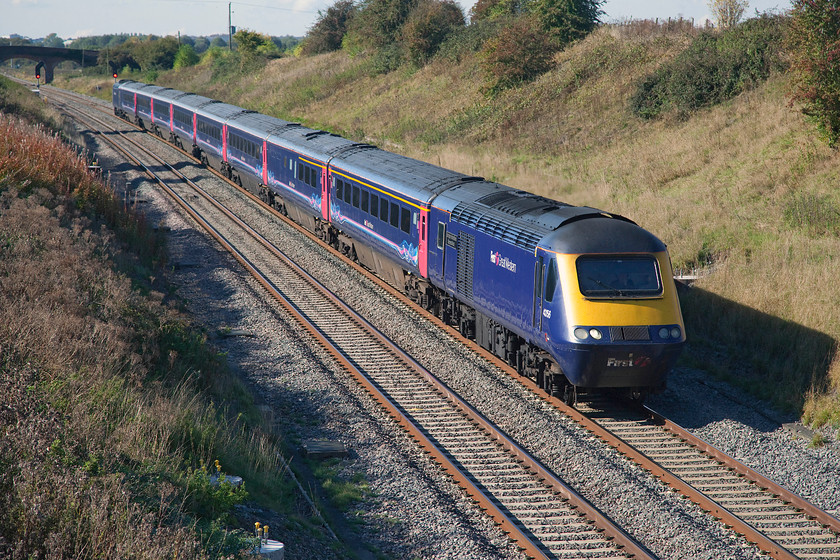 43156 & 43040, GW 12.58 Bristol Parkway-London Paddington (1L55), Bourton SU233875 
 Using my zoom lens has foreshortened the HST forming the 12.58 Bristol Parkway to Paddington as it passes Bourton in the far west of Oxfordshire. The HST is being led by 43156 'Dartington International Summer School' with 43040 at the rear. The trailing power car has been earning its keep on this route since its introduction as part of set 253020 in 1976; a quite incredible achievement and testament to the design of this train. Notice the electrification mast pilings all set to ruin the lovely open virew from this bridge. 
 Keywords: 43156 43040 12.58 Bristol Parkway-London Paddington 1L55 Bourton SU233875