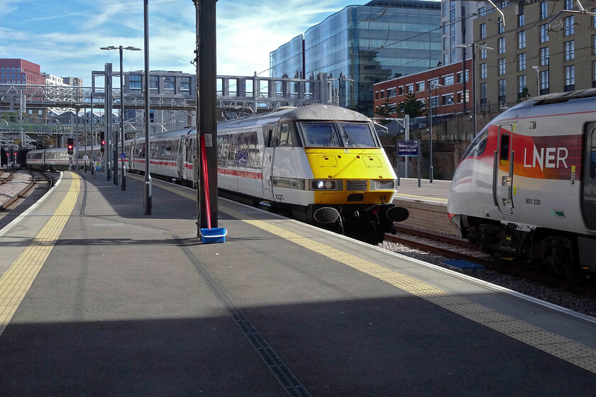 82211, GR 06.05 Leeds-London King's Cross (1A04, 8L) & 801230, GR 09.06 London King's Cross-York (1N81, RT), London King's Cross station 
 The first up Leeds service of the day arrives at King's Cross led by DVT 82211. It is coming into platform two with 801230 waiting at platform one to work the 09.06 train to York. Apologies for the poor quality of this digital image, and a number of others for that matter, but my regular and, until now that is, dependable Canon GX1 Mk.III is in for repair forcing me to use an emergency purchased Sony DSC-WX500. Whilst it seems a reasonable budget camera with a good zoom it cannot handle what I expect of my equipment but needs be needs must I suppose! 
 Keywords: 82211 06.05 Leeds-London King's Cross 1A04 801230 09.06 London King's Cross-York 1N81 London King's Cross station IC225 LNER Azuma