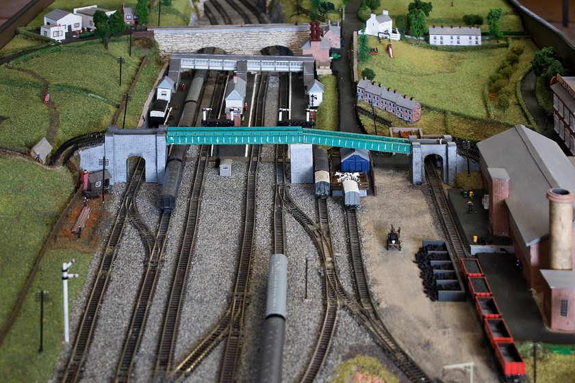 Roade station and yard, from scale model of Roade Cutting, Roade Village Hall 
 A section of the scale model of the railway through Roade showing the station and its yard. The factory to the right has recently been demolished and a huge housing development is taking its place. There has been numerous calls for the reopening of the station at Roade, the site is still largely undeveloped so it would be feasible if the various parties really wanted to make it happen! However, as a local resident, I don't think it will happen in my lifetime! 
 Keywords: Roade station and yard Roade Village Hal