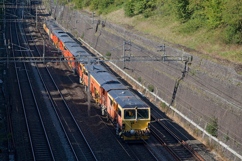 56113, 56087, DR73906, DR73907 & DR73910, 14.17 Bletchley CS-Guide Bridge (6Z56), Roade Cutting 
 Out of view on the front of this unusual working are 56113 and 56087. They are towing three track machines as the 14.17 Bletchley carriage sidings to Guide Bridge running as 6Z56 and are passing through Roade Cutting. 
 Keywords: 56113 56087 DR73906 DR73907 DR73910 14.17 Bletchley CS-Guide Bridge 6Z56 Roade Cutting