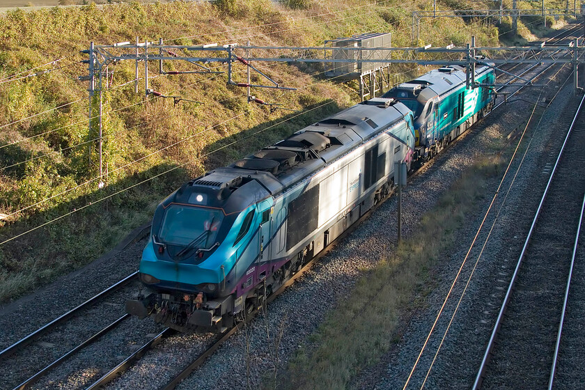 3. 68020 & 68008, 09.28 Wembley LMD-Gresty Bridge (0K69, 3L), Victoria bridge 
 Just catching some winter afternoon sunshine 68020 'Reliance' pilots 68008 'Avenger' returning north as the 0K69 09.28 Wembley LMD to Crewe Gresty Bridge. Having been handed back to DRS by Transpennine as they wind down their use of NOVA 3 trains 69020 still retains its TPE livery and surprisingly its branding. 69008 is in the more normal DRS house livery. The locomotives are returning to Gresty Bridge for servicing and an exam. following use with Chiltern on their locomotive hauled services. 
 Keywords: 68020 68008 09.28 Wembley LMD-Gresty Bridge 0K69 Chiltern Victoria bridge Reliance Avenger