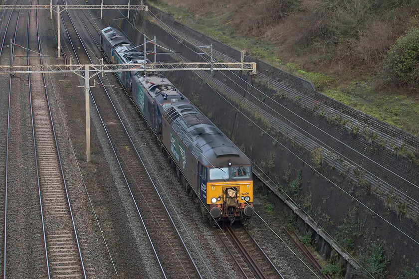 57306, 88007, 68001 & 66432, 06.38 Crewe Gresty Bridge-Wembley Yard (0A68, 9E), Roade cutting 
 DRS operate a regular Saturday morning light engine(s) move from their depot at Crewe's Gresty Bridge to Wembley in order to, ostensively to swap Class 68s that operate Chiltern's locomotive hauled services. They will often add another loco. or two to the move but this particular lineup is unusual. With the combo coming into view as I arrived at the bridge in Roade cutting I just managed to get the camera out of the bag and capture 57306 'Her Majestys Railway Inspectorate 175' leading 88007, 68001 'Evolution' and 66432 at the rear. 
 Keywords: 57306 88007 68001 66432 06.38 Crewe Gresty Bridge-Wembley Yard 0A68 Roade cutting Her Majestys Railway Inspectorate 175 Evolution