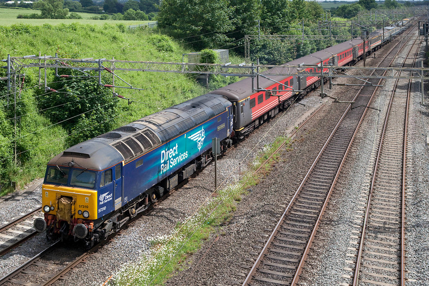 57310, 14.08 London Euston-Burton-ot-Wetmore ECS (5Z58), Victoria bridge 
 Having finished its duties of ferrying charity mountain climbers around for the last few days, 57310 'Pride of Cumbria' brings the ECS back from Euston as the 14.08 5Z58 to Burton-ot-Wetmore. The stock is right old rag-bag collection including some examples Mk.II ex. Virgin, Inter City Swallow and BR blue coaches. 
 Keywords: 57310 14.08 London Euston-Burton-ot-Wetmore ECS 5Z58 Victoria bridge