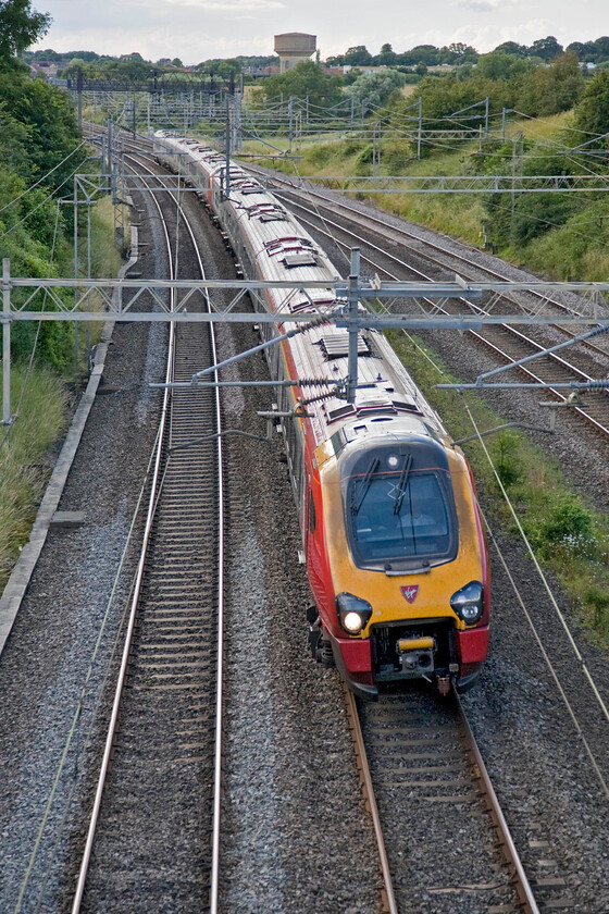 Class 221, 12.51 Edinburgh Waverley-London Euston (9M56), Victoria bridge 
 The 12.51 Edinburgh to London Euston Virgin West Coast service is now just over half an hour from its destination as it sweeps around the curve after leaving Roade cutting some half a mile to the north. The Anglo Scottish express (that ought to be worked by a Pendolino really!) is being worked by two unidentified Class 221 Voyagers. 
 Keywords: Class 221 12.51 Edinburgh Waverley-London Euston 9M56 Victoria bridge Virgin West Coast Voyager