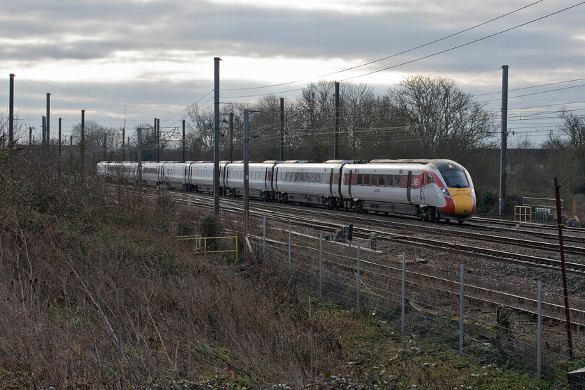 800125, GR 08.30 London King's Cross-Darlington (1F08, 1E), Tallington Dowmac 
 Darlington is not usually a destination for LNER services from King's Cross. However, as engineering works had closed the route north from there to Newcastle the dreaded bustitution was in operation! Taken from a long bank adjacent to the Dowmac concrete plant at Tallington 800125 heads north with the 08.30 King's Cross to Darlington service. 
 Keywords: 800125 08.30 London King's Cross-Darlington 1F08 Tallington Dowmac LNER Azuma