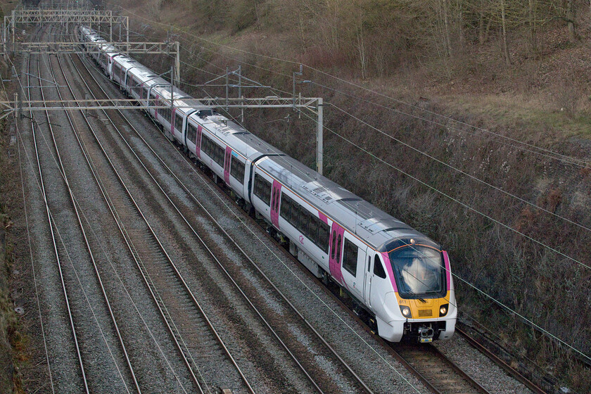 720611 & 720609, 14.18 Nuneaton-Wembley Yard (5Q94, 3E), Hyde Road bridge 
 With deliveries underway the Class 7201XX and 5XX subsets have started entering service with Greater Anglia. However, at the time of writing (Jan '23) the order for twelve 7206XX sets has yet to enter service with C2C with them undergoing mileage accumulation and testing. 720611 and 720609 pass through Roade seen passing under Hyde Road bridge as the 5Q94 14.18 Nuneaton to Wembley Yard run. I quite like the livery applied to these new units with it being kept relatively plain and simple but I am not too sure how well the white will hold up in use? 
 Keywords: 720611 720609 14.18 Nuneaton-Wembley Yard 5Q94 Hyde Road bridge C2C