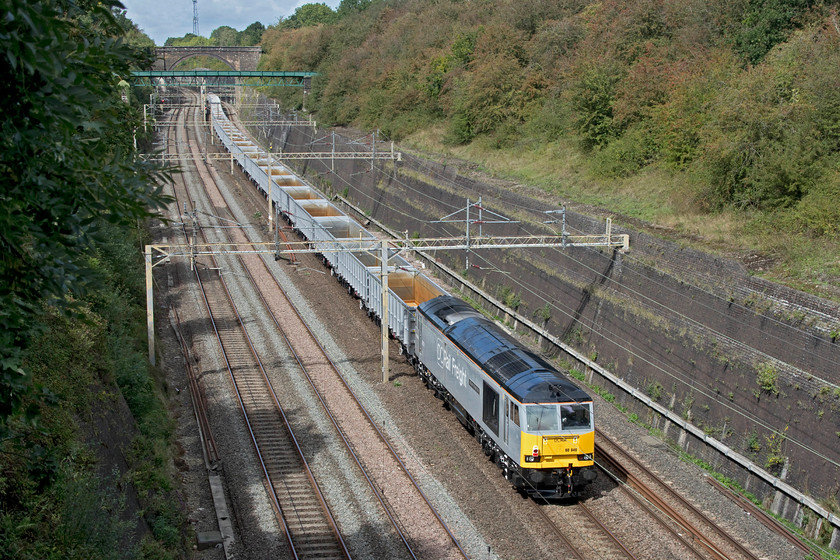 60046, 12.32 DB Cargo Fan (Wembley)-Humberstone Road (6Z35, 12L), Roade cutting 
 Dead in tow on the rear of the 12.32 DB Cargo vans (Wembley to Humberstone Road) 60046 'William Wilberforce' is dragged through Roade cutting. I am not quite sure why the Class 60 was taken along for the ride behind a rake of brand new imported JNA stone wagons but it certainly made the train a little more interesting! 
 Keywords: 60046 12.32 DB Cargo Fan Wembley to Humberstone Road 6Z35 Roade cutting JNA wagons William Wilberforce