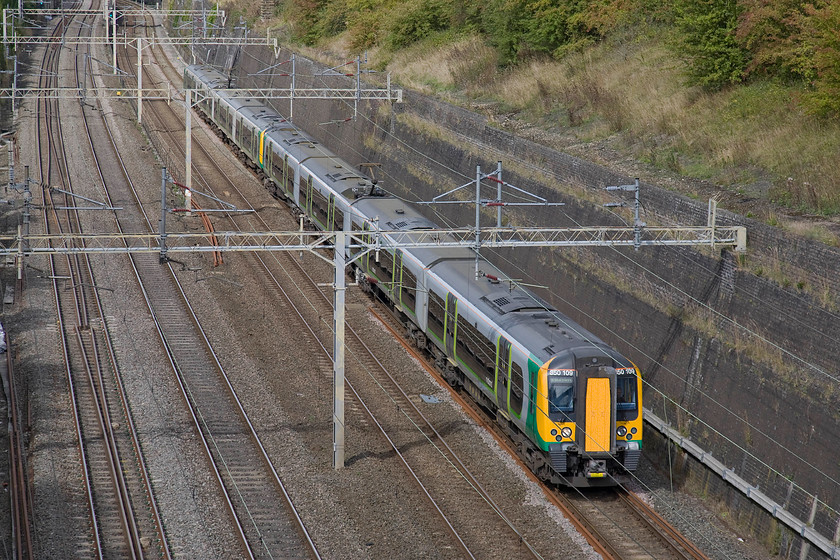 350109 & 350259, LM 12.14 Birmingham New Street-London Euston (2Y13), Roade cutting 
 I really like taking pictures in sunny conditions at this time of year. The light is warmer and less harsh and with the sun lower in the sky gives far better illumination of the subject. Taking in some of this delicious autumn sun are 350109 and 350259 forming the 12.14 Birmingham New Street to Euston seen passing through Roade cutting. 
 Keywords: 350109 350259, LM 12.14 Birmingham New Street-London Euston (2Y13), Roade cutting London Midland Desiro