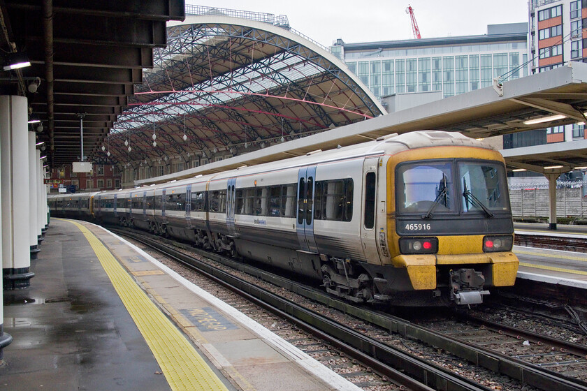 465916, SE 11.27 London Victoria-Orpington (2M50, RT), London Victoria station 
 There are one hundred and forty-seven Networkers in operation, a Class dating from 1992 making them over thirty years old. However, through a number of overhauls and upgrades during this time they still remain in frontline operation and seem relatively modern. Interestingly, they only have a maximum speed of seventy-five mph but I suppose that is not an issue given where they operate with constant slowing and starting from many stations. Their BR Mk. III heritage is clear to see in this view looking down the leading carriage of 465916 that will soon work the 2M50 11.27 to Orpington from Victoria. 
 Keywords: 465916 11.27 London Victoria-Orpington 2M50 London Victoria station SouthEastern Networker